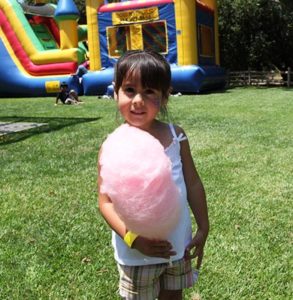 child with cotton candy